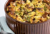 Savory Cheesy Bread Pudding with Herbs and Crispy Top