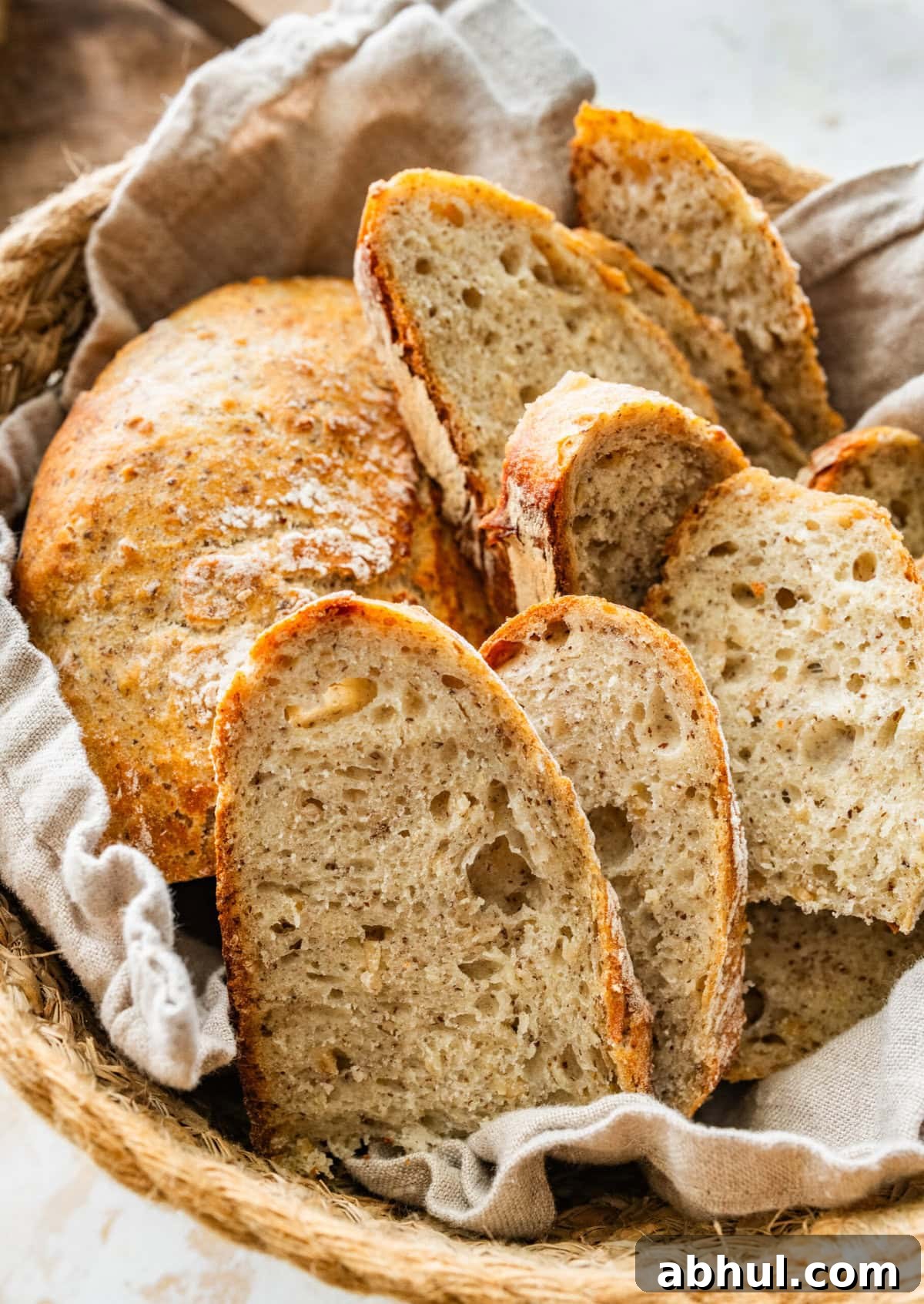 Rustic Italian bread sliced and in a basket. 
