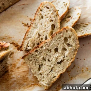 Slices of rustic Italian bread on cutting board.