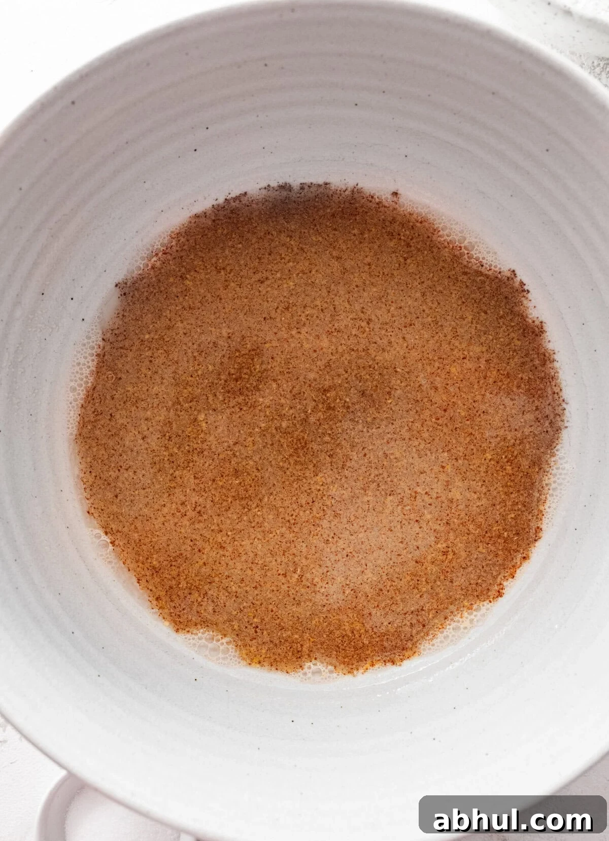 Yeast and water in a bowl. 