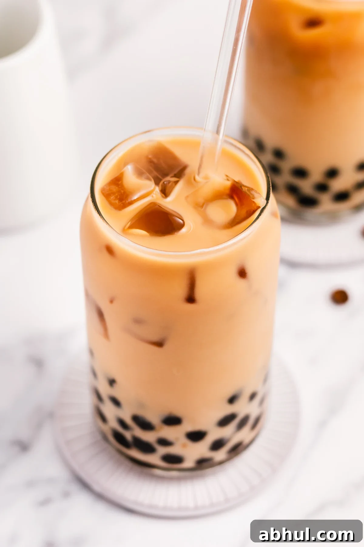 Boba coffee is naturally gluten free and can easily be dairy free as well. It uses only four ingredients to create a refreshing, visually appealing drink easily and quickly. Making your own bubble coffee at home saves you money and this versatile recipe can be tuned to your personal taste and hits the spot anytime from breakfast into the evening. #bobacoffee #bubblecoffee #glutenfreerecipes #dairyfreerecipes #glutenfreedairyfreerecipes #healthybreakfastrecipes