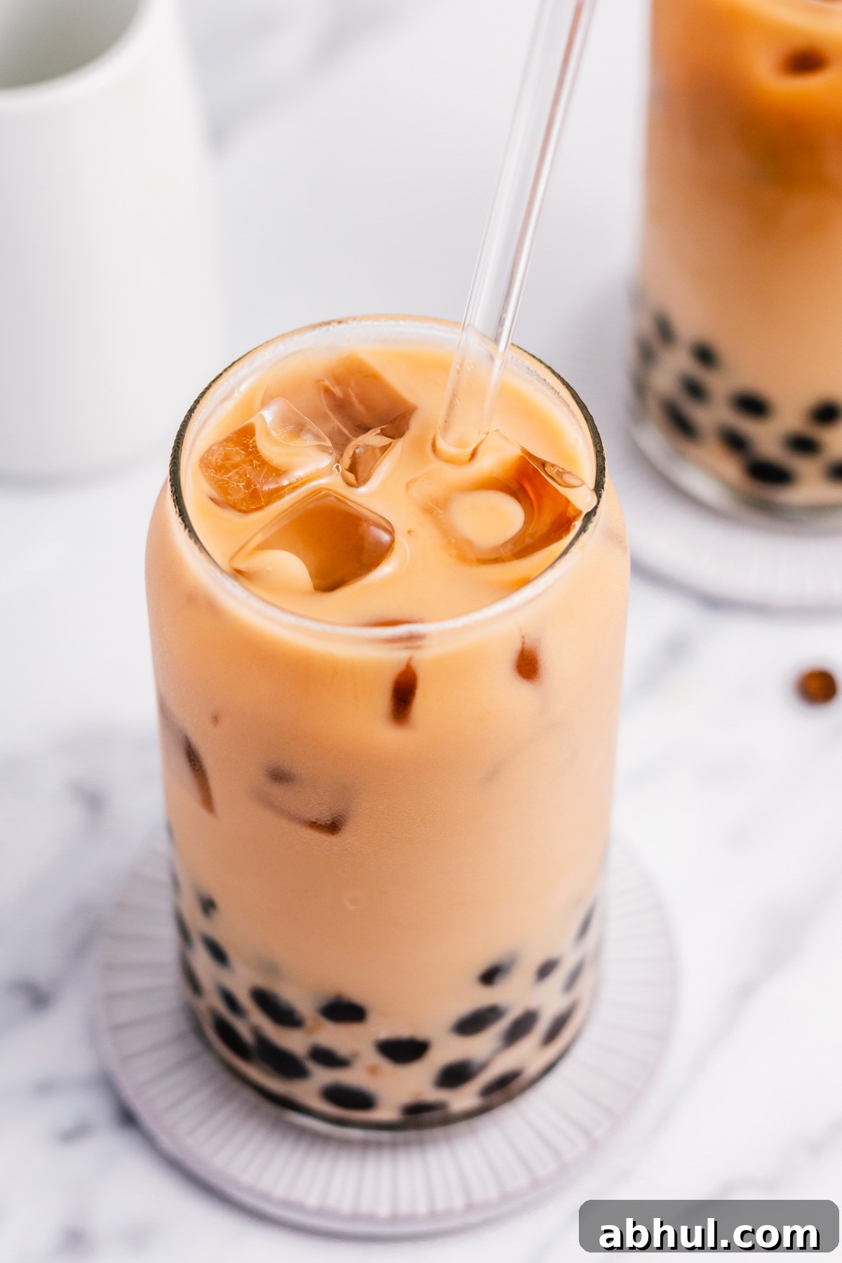Boba coffee is naturally gluten free and can easily be dairy free as well. It uses only four ingredients to create a refreshing, visually appealing drink easily and quickly. Making your own bubble coffee at home saves you money and this versatile recipe can be tuned to your personal taste and hits the spot anytime from breakfast into the evening. #bobacoffee #bubblecoffee #glutenfreerecipes #dairyfreerecipes #glutenfreedairyfreerecipes #healthybreakfastrecipes