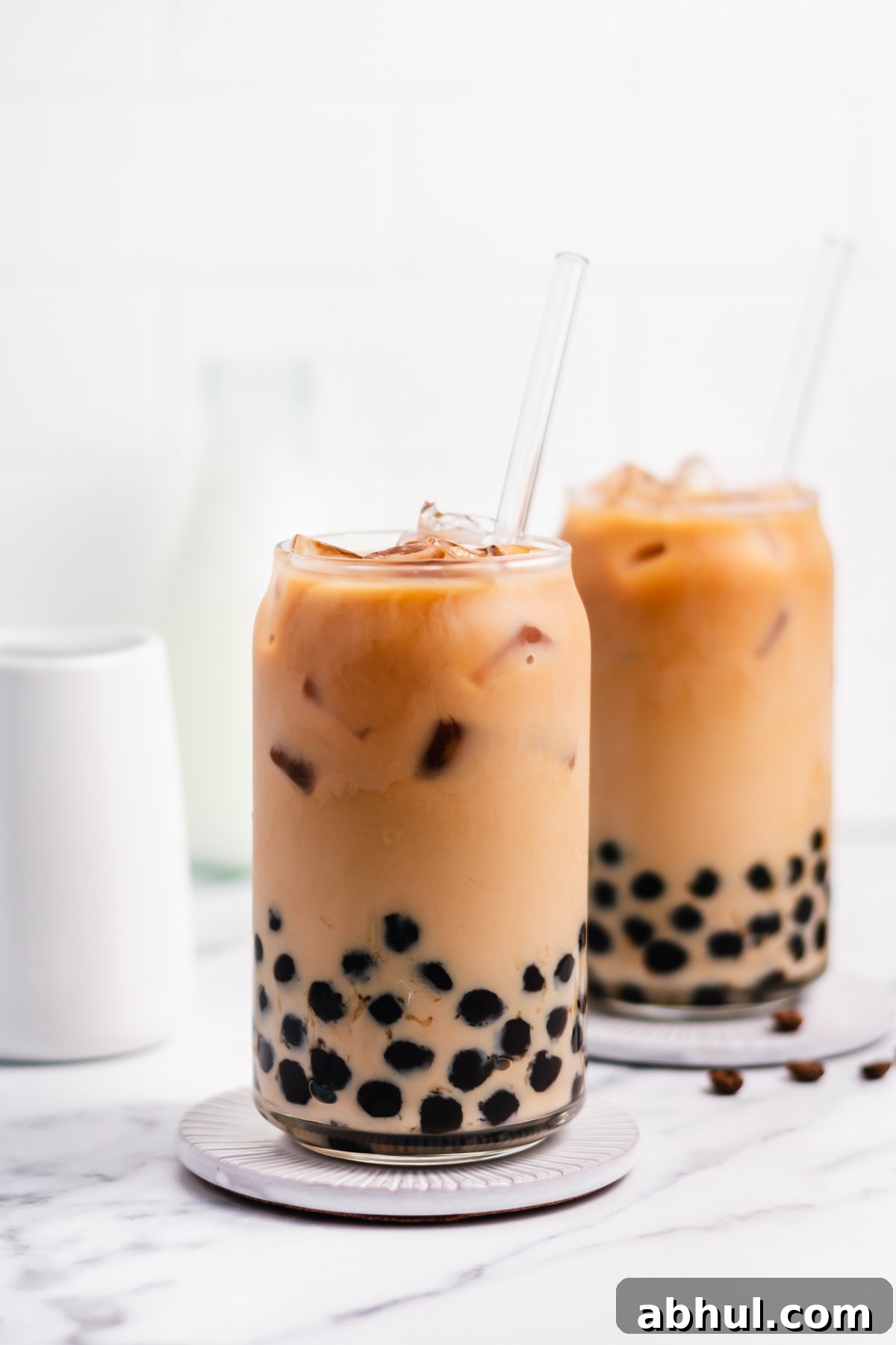 Boba coffee is naturally gluten free and can easily be dairy free as well. It uses only four ingredients to create a refreshing, visually appealing drink easily and quickly. Making your own bubble coffee at home saves you money and this versatile recipe can be tuned to your personal taste and hits the spot anytime from breakfast into the evening. #bobacoffee #bubblecoffee #glutenfreerecipes #dairyfreerecipes #glutenfreedairyfreerecipes #healthybreakfastrecipes