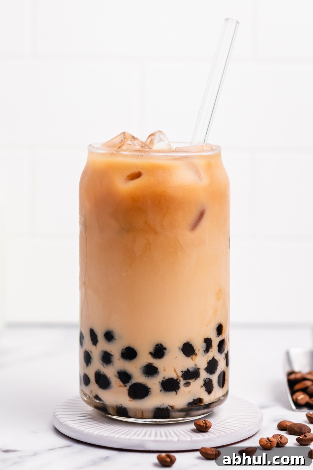 Boba coffee is naturally gluten free and can easily be dairy free as well. It uses only four ingredients to create a refreshing, visually appealing drink easily and quickly. Making your own bubble coffee at home saves you money and this versatile recipe can be tuned to your personal taste and hits the spot anytime from breakfast into the evening. #bobacoffee #bubblecoffee #glutenfreerecipes #dairyfreerecipes #glutenfreedairyfreerecipes #healthybreakfastrecipes
