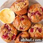 Raspberry and banana muffins on a plate