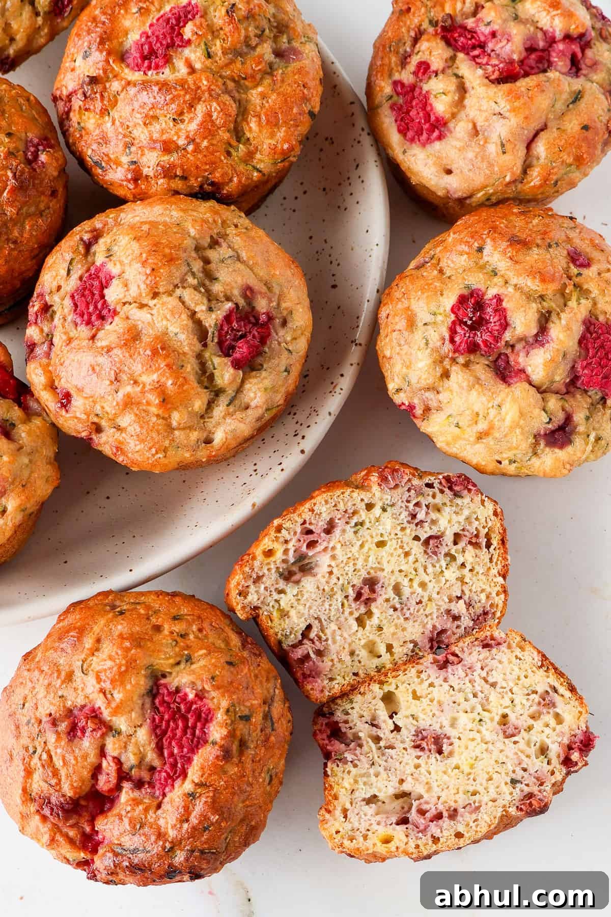 Inside shot of one banana raspberry muffin cut in half.