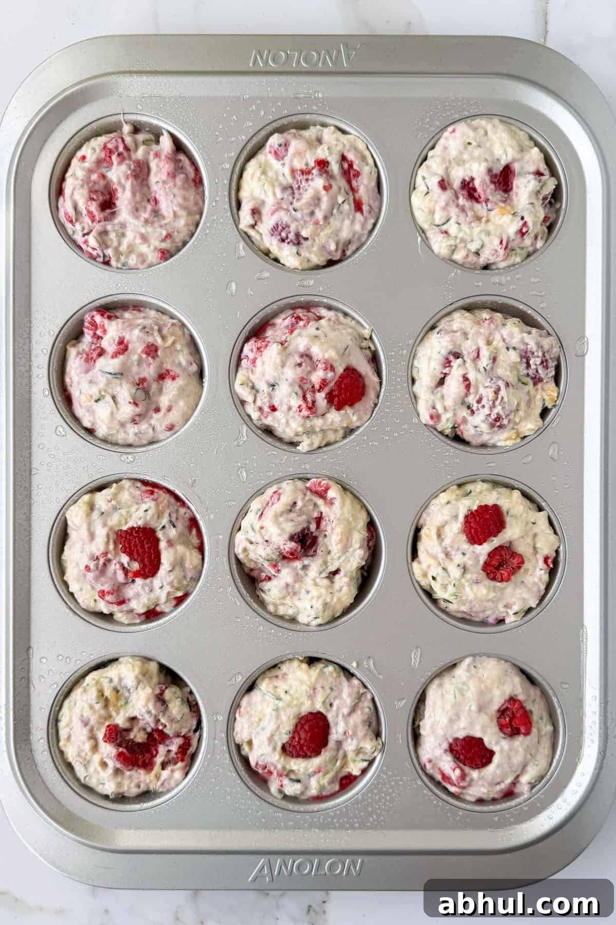 Batter added to muffin pan.