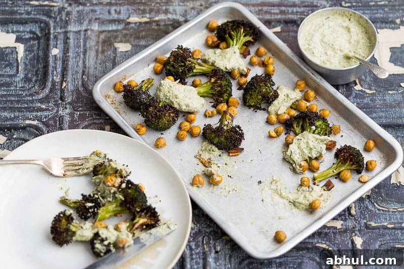 Roasted broccoli is a revelation! It’s a great way to cook this green, adding a welcome texture which can easily be ruined by boiling. Coated with garlic and olive oil, along with slightly crisped and browned edges, it brings a completely different flavour to this Brassica. Throwing in some chickpeas and a herb yoghurt rounds it off beautifully, making a truly engrossing vegetarian side dish to bring to the table.