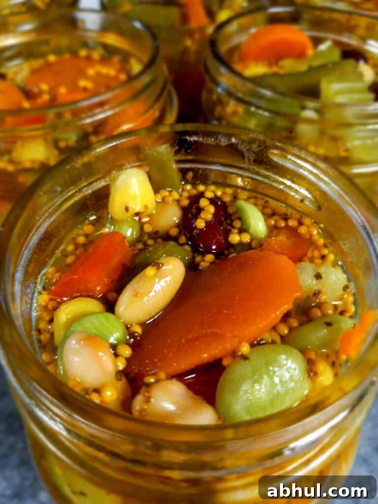 jars filled with Amish chow chow ready to be sealed