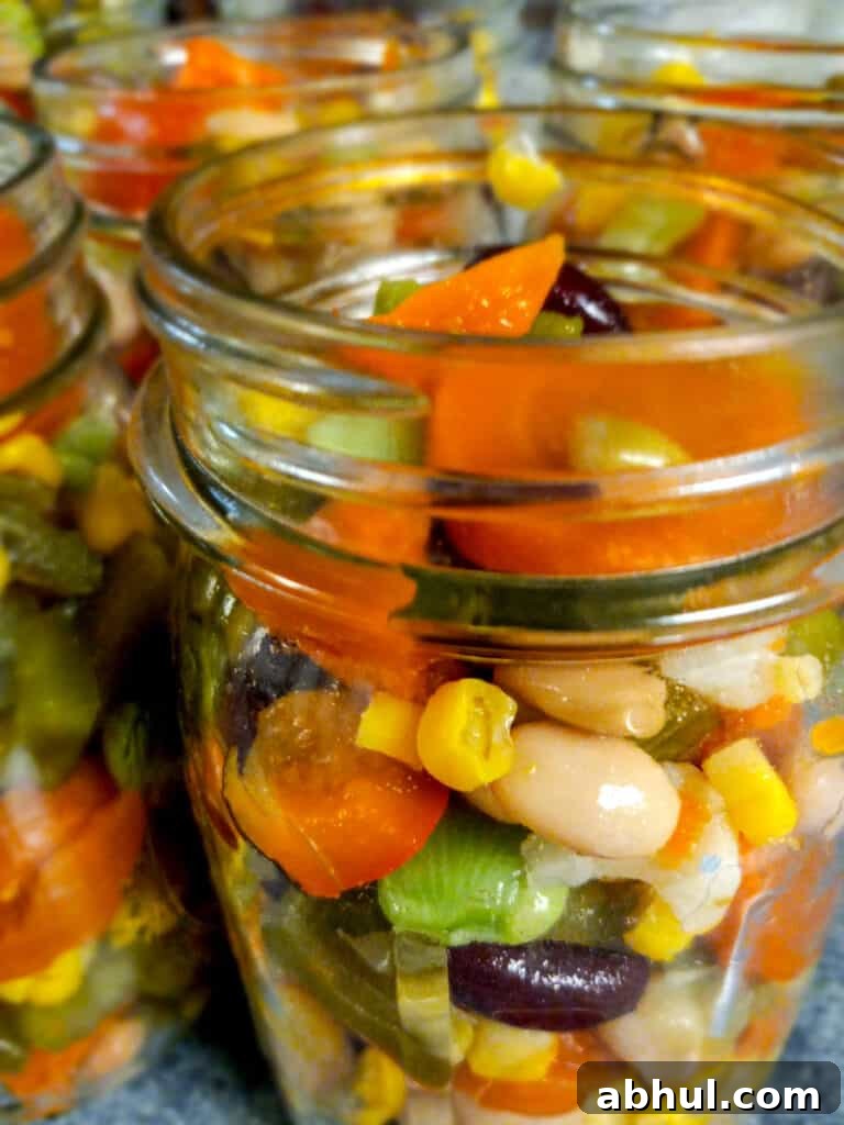 side view of jars filled with colorful veggies