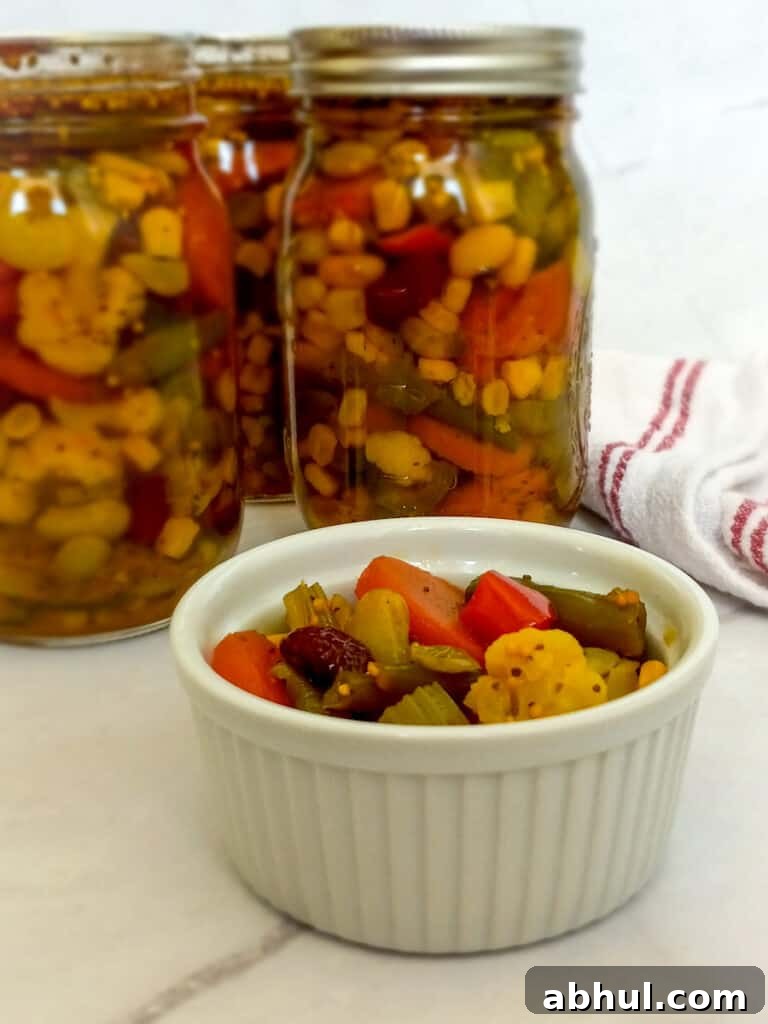 three jars and a dish filled with PA Dutch chow chow