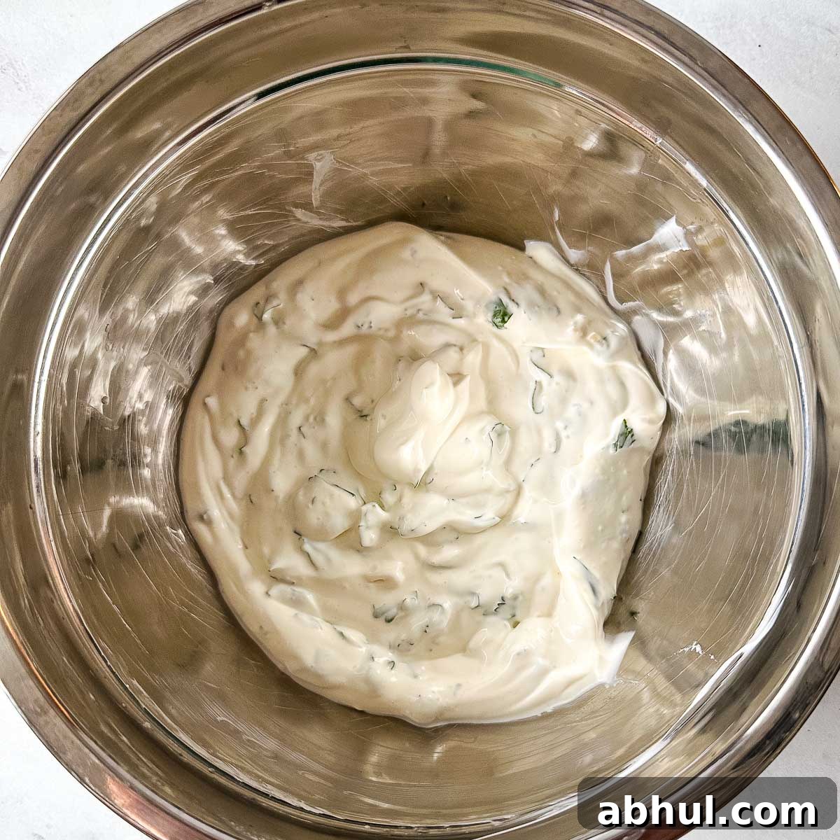 Cilantro lime crema in a silver bowl.