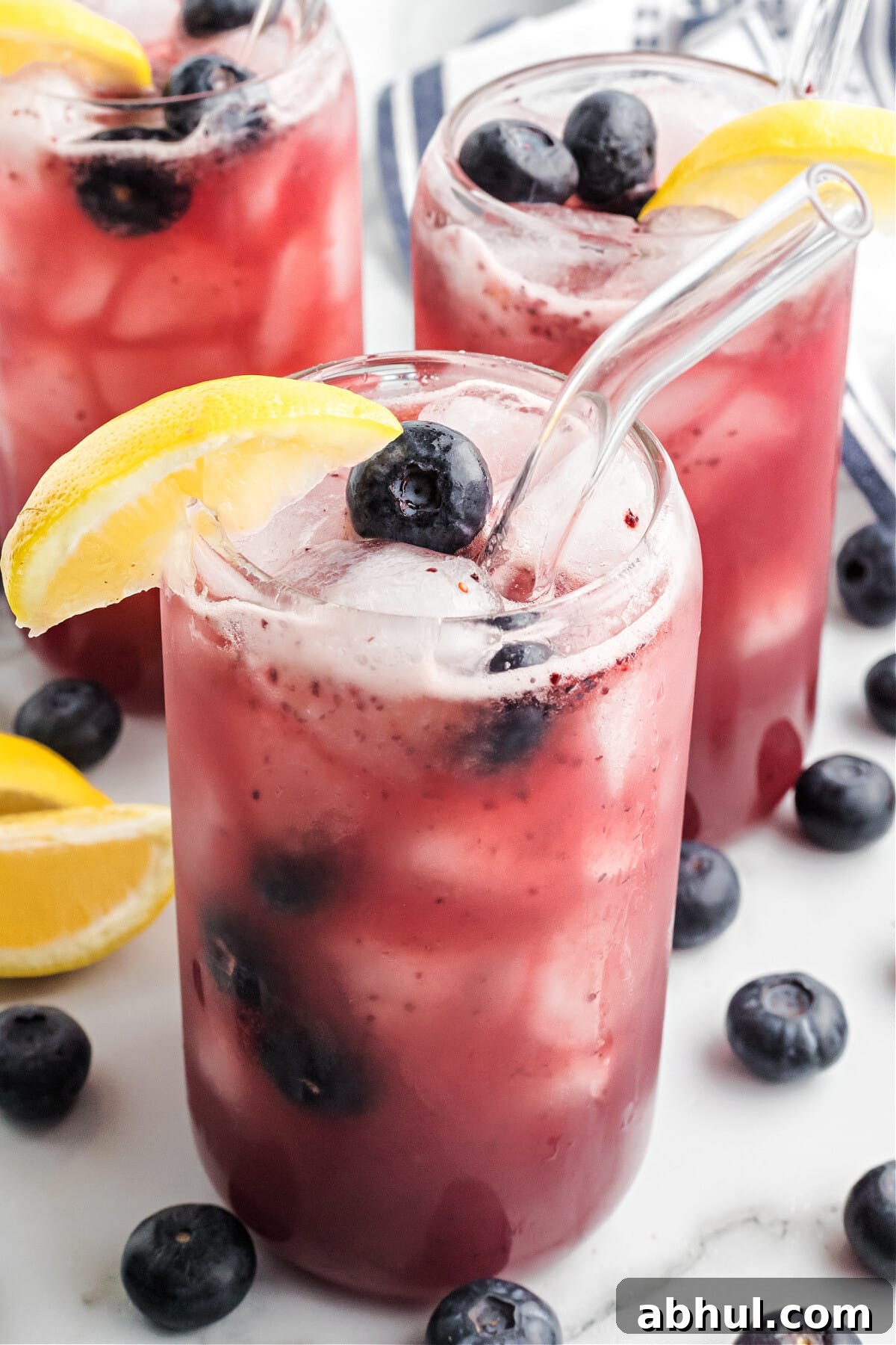 Refreshing Blueberry Lemonade Recipe with Fresh Citrus Twist 10 blueberry lemonade in glasses with clear straws