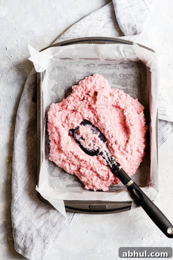 Strawberry Coconut Frozen Squares: Refreshing No-Bake Treat 16 top view close up of baking tin with strawberry coconut mix