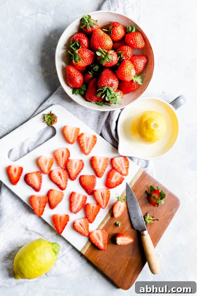 Strawberry Coconut Frozen Squares: Refreshing No-Bake Treat 6 overhead view of fresh strawberries cut into slices