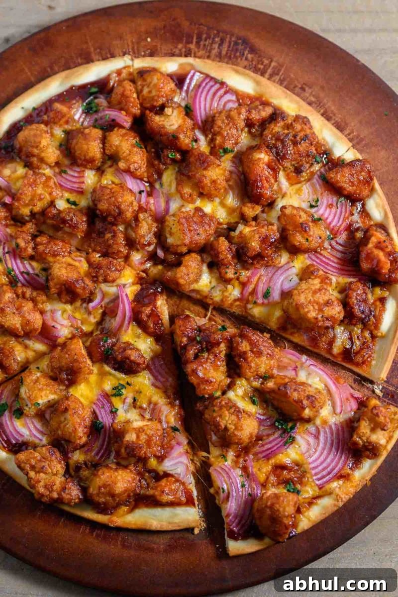 Chicken Nugget Pizza on a pizza stone.