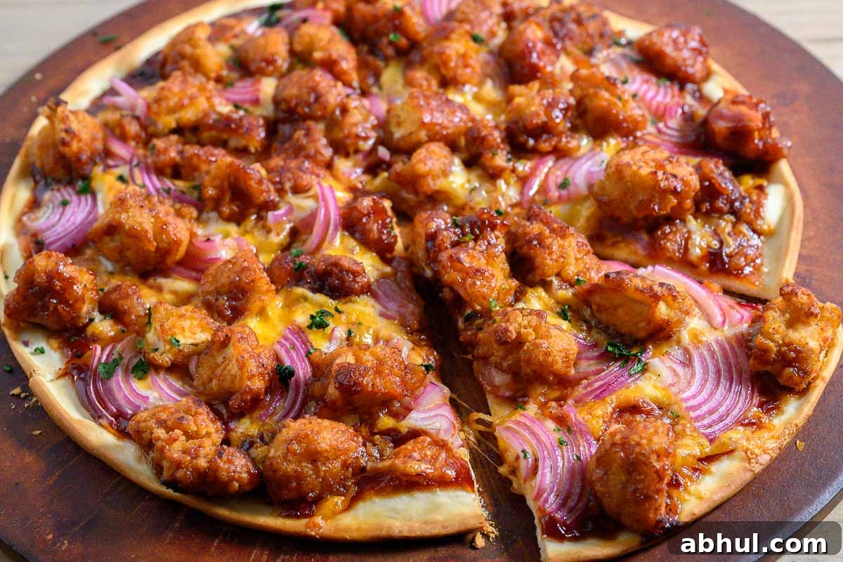 Nugget Pizza on a pizza stone.