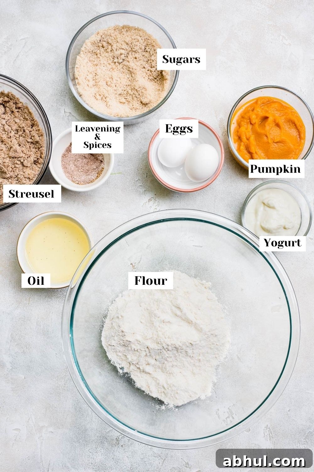 ingredients for pumpkin coffee cake in bowls with labels