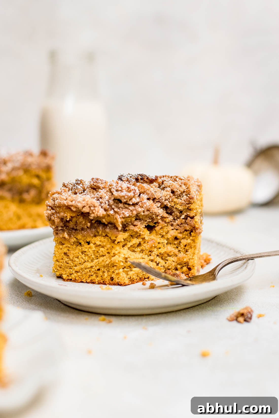 pumpkin coffee cake with piece of cake missing