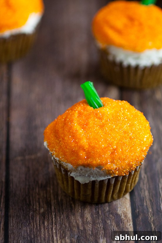 Sparkle Pumpkin Cupcakes Tutorial - Make these fun, easy, and festive Sparkle Pumpkin Cupcakes in just 4 simple steps for adorable Fall and Halloween treats!