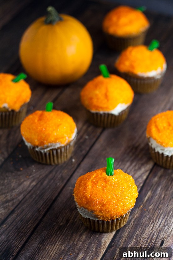 Sparkle Pumpkin Cupcakes Tutorial - Make these fun, easy, and festive Sparkle Pumpkin Cupcakes in just 4 simple steps for adorable Fall and Halloween treats!