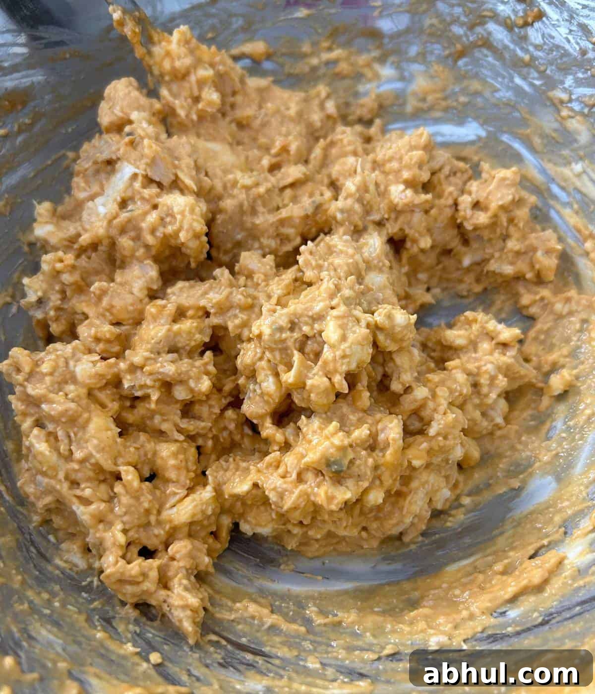 Buffalo chicken filling in silver bowl.