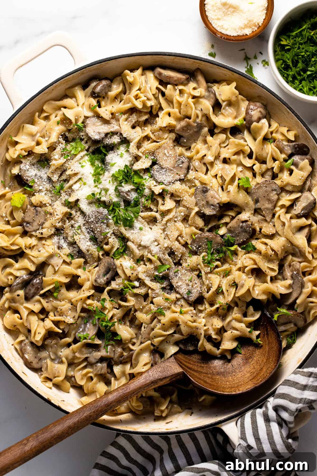 Large sauté pan filled with one pot mushroom stroganoff garnished with parsley