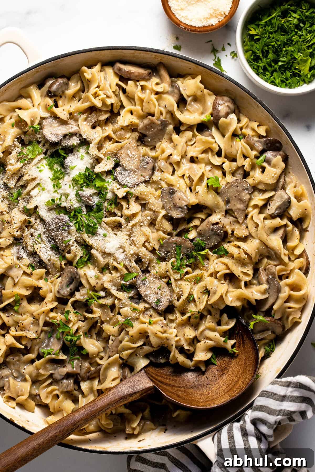 Large sauté pan filled with one pot mushroom stroganoff garnished with parsley