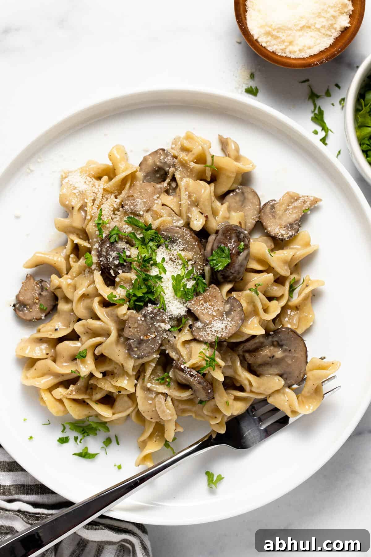 Large white plate filled with one pot mushroom stroganoff garnished with parsley
