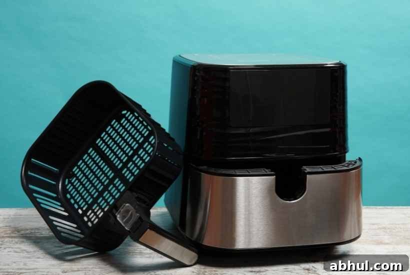 Choosing the Perfect Air Fryer: A Buyer's Guide for Your Kitchen 3 air fryer with basket sitting next to it