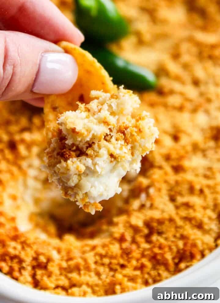 Jalapeño popper dip being scooped