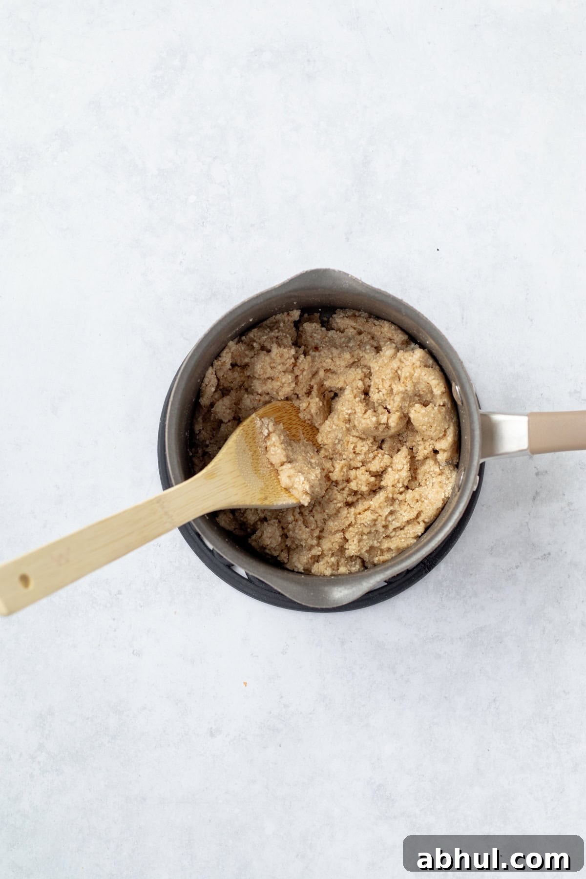 Fluffy Passover Matzo Meal Sandwich Rolls 5 Stirring matzo meal in a pot.