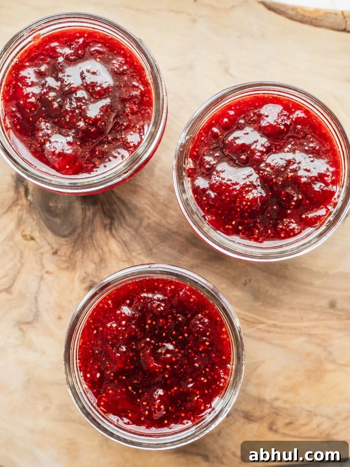 Strawberry-Balsamic Jam with Black Pepper — Homemade Recipe 11 3 mason jars filled with strawberry balsamic vinegar jam.