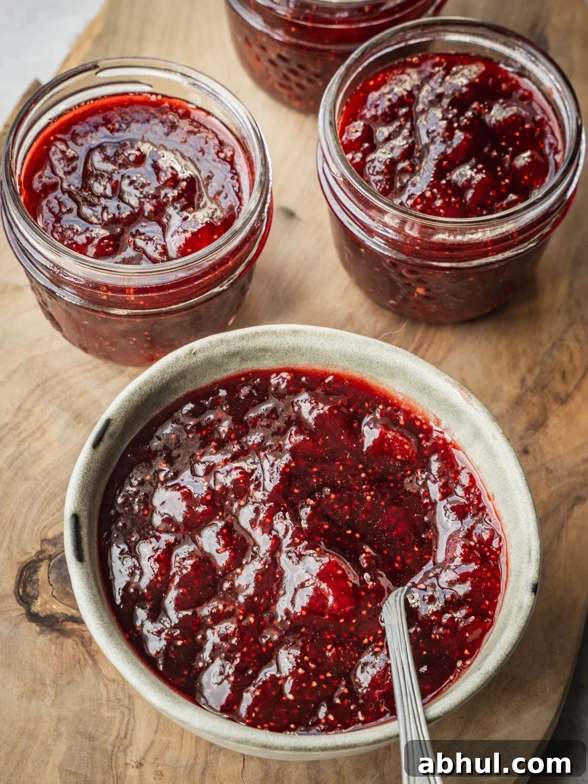 Strawberry-Balsamic Jam with Black Pepper — Homemade Recipe 12 A bowl and mason jars with Strawberry Balsamic Black Pepper Jam.