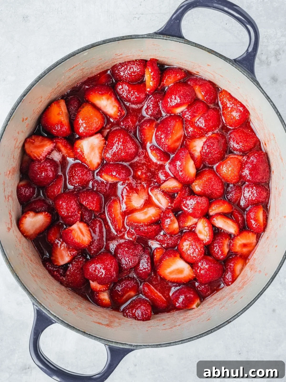 Strawberry-Balsamic Jam with Black Pepper — Homemade Recipe 6 Recipe step showing the strawberries, sugar and lemon starting to cook.