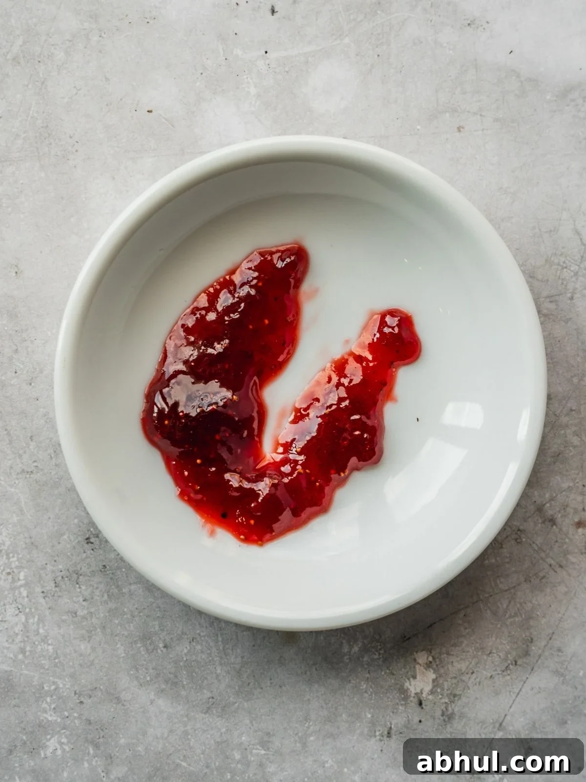 Strawberry-Balsamic Jam with Black Pepper — Homemade Recipe 9 Testing the jam on a small cold plate by seeing if it forms a skin.