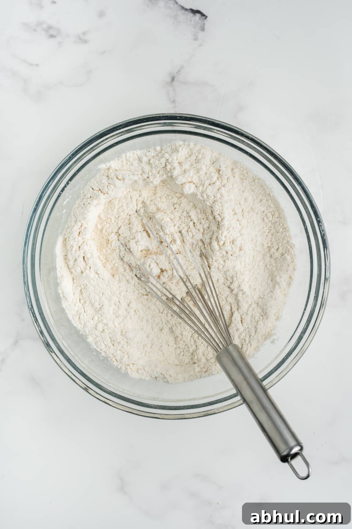 Christmas Crack Cookies Recipe: Salty-Sweet Holiday Crackers 4 Dry ingredients for making these cookies mixed together in a bowl.
