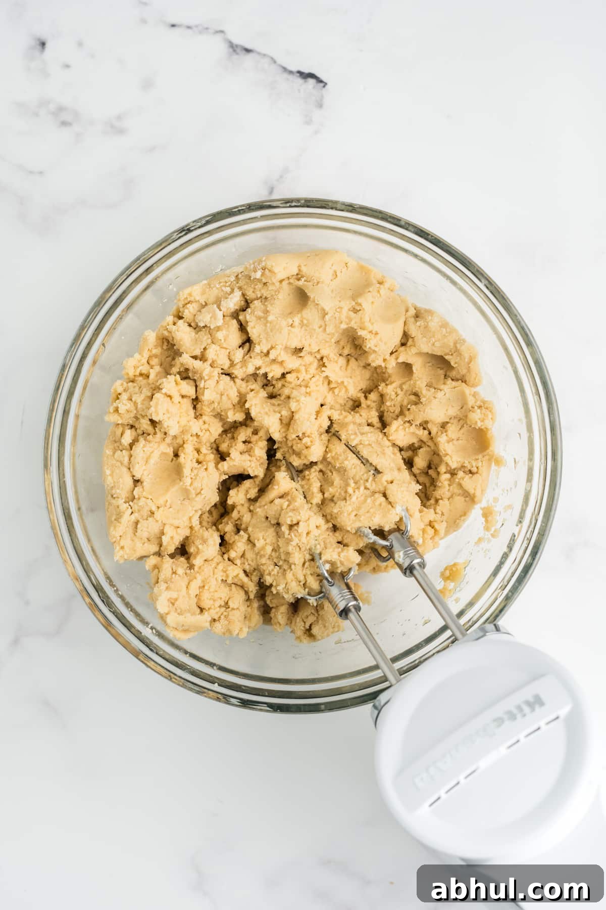Christmas Crack Cookies Recipe: Salty-Sweet Holiday Crackers 7 The wet and dry ingredients combined in a mixing bowl.