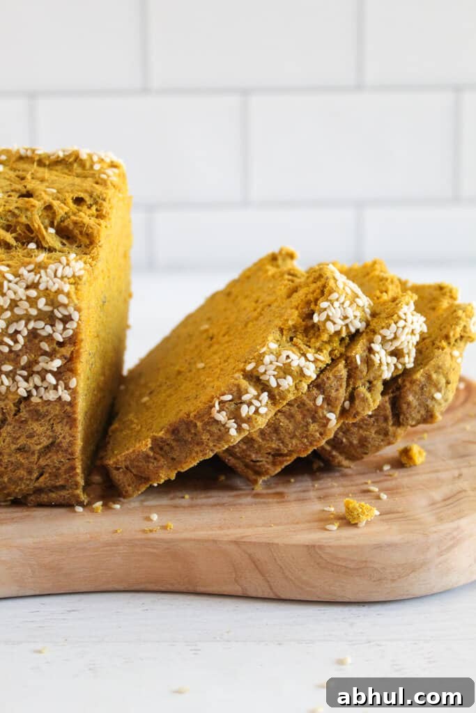 slices of chia seed bread on a cutting board.