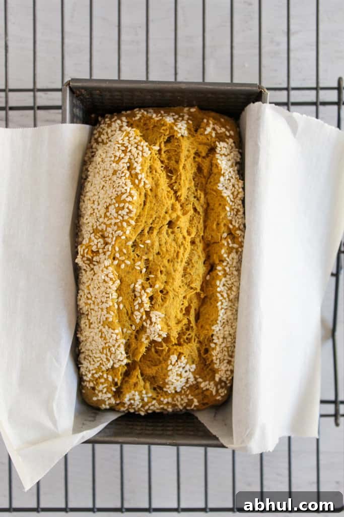 baked loaf of chia seed bread in a baking pan.