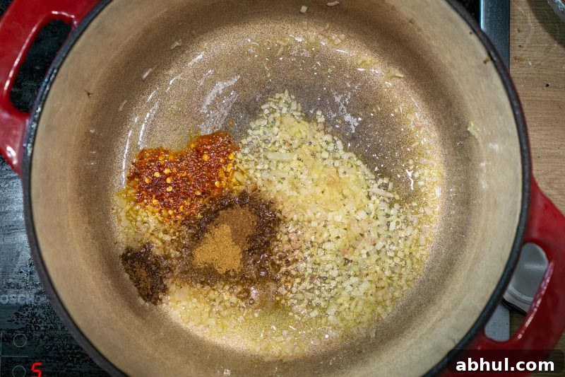 Cream-Free Vegan Roasted Cauliflower Soup Recipe 6 Cooking the spices of the soup