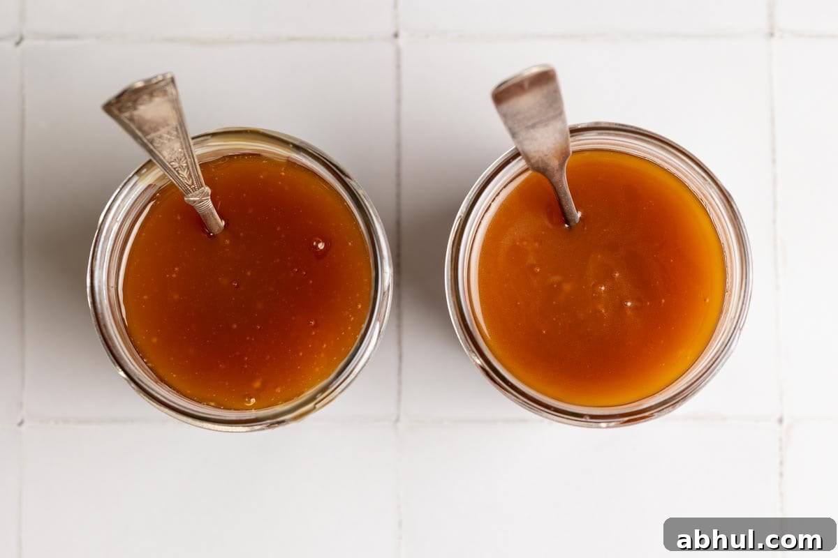 Two glass jar of coconut caramel sauce side by side.