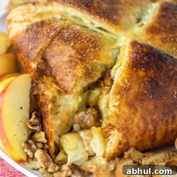 close-up of baked brie in puff pastry cut into