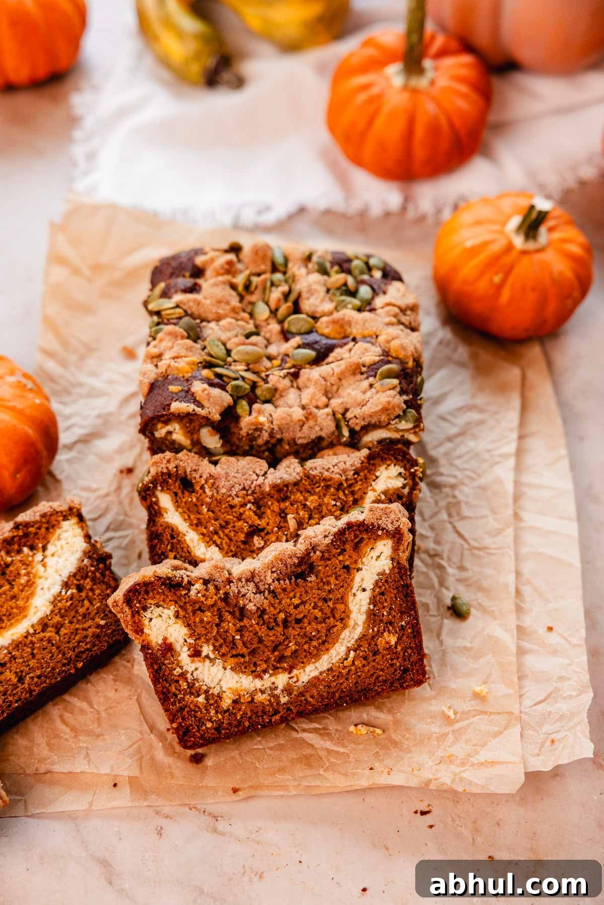 pumpkin cream cheese bread with pumpkin seed streusel topping
