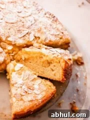 sliced almond coffee cake with gooey almond topping