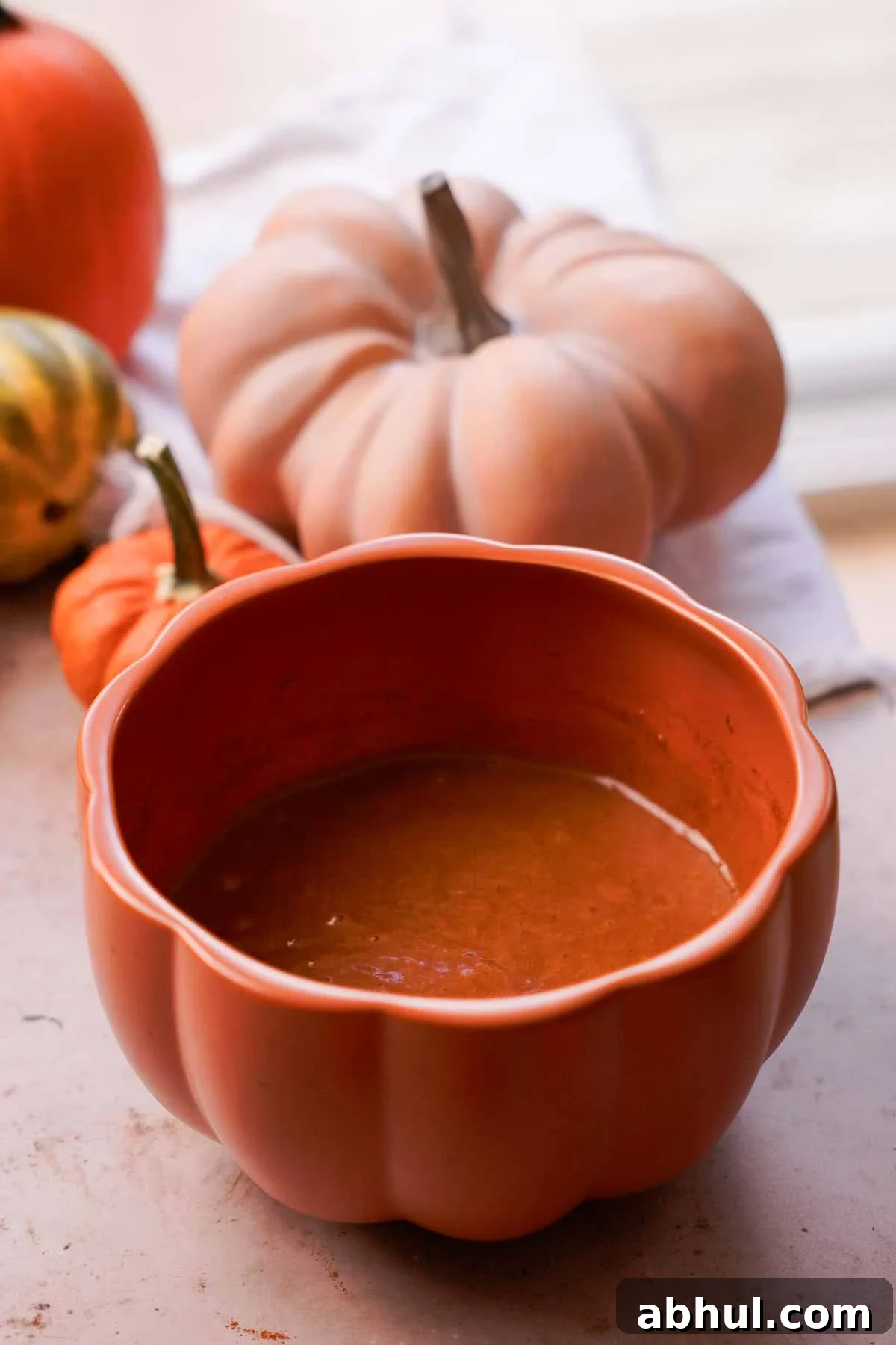 wet ingredients in a pumpkin bowl for pumpkin bread batter