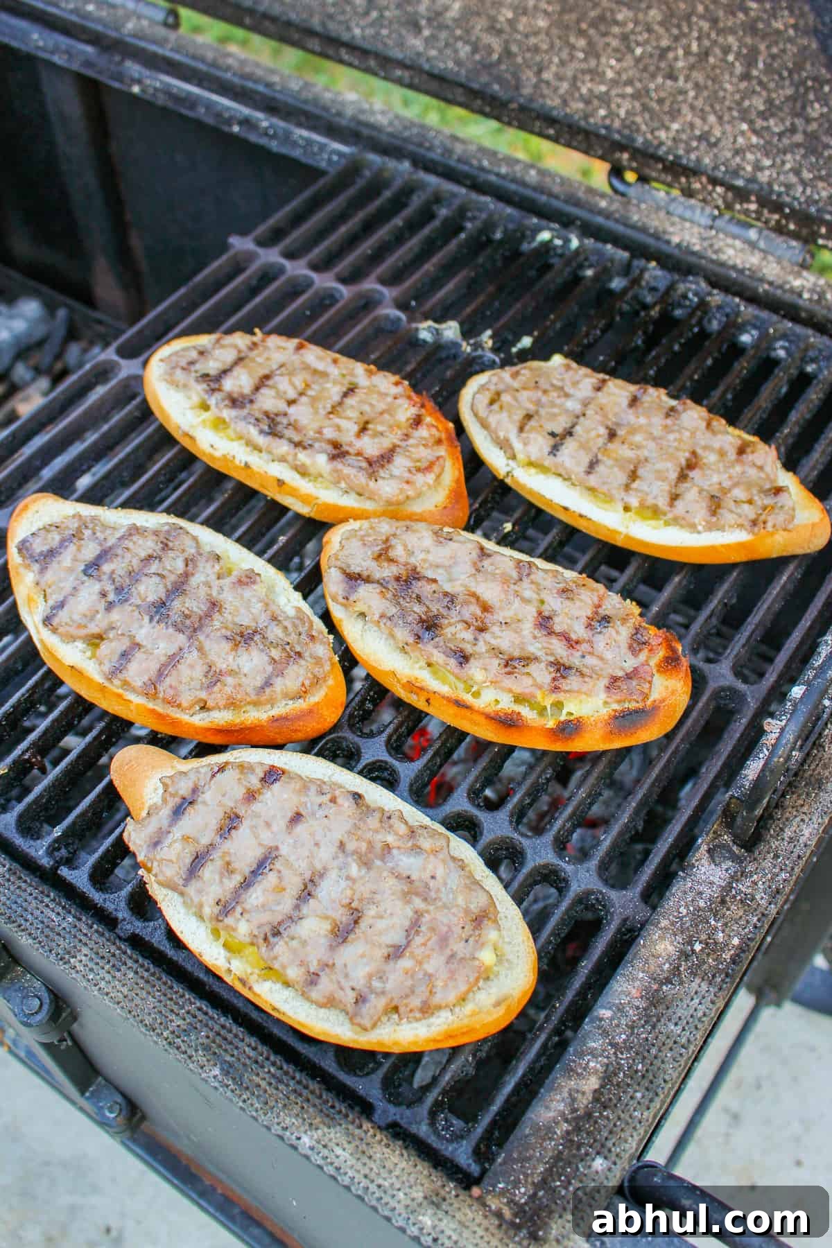 Showing the grill marks on the flipped hoagies.