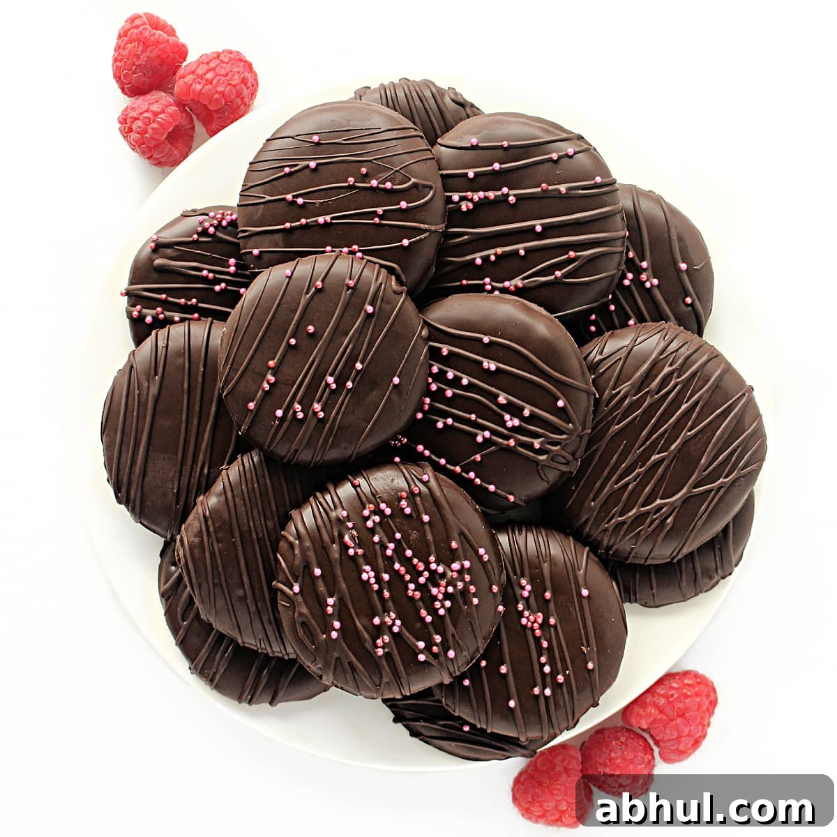 Choclate coated cookies on a platter.