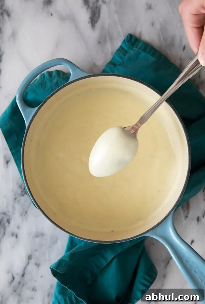 Making vanilla pudding: testing consistency on the back of a spoon