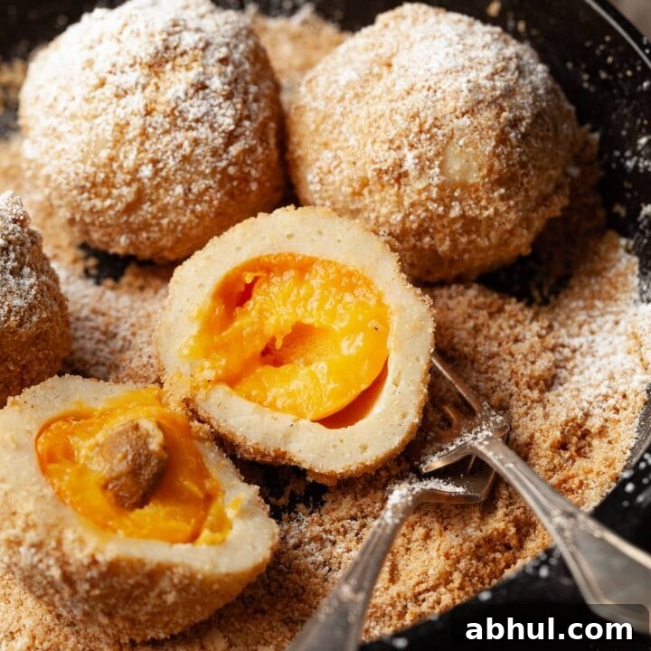 Discover Austria's famous Marillenknödel, gluten-free and perfect for apricot season. Sweet apricots wrapped in dough, boiled, and coated in sweet breadcrumbs.